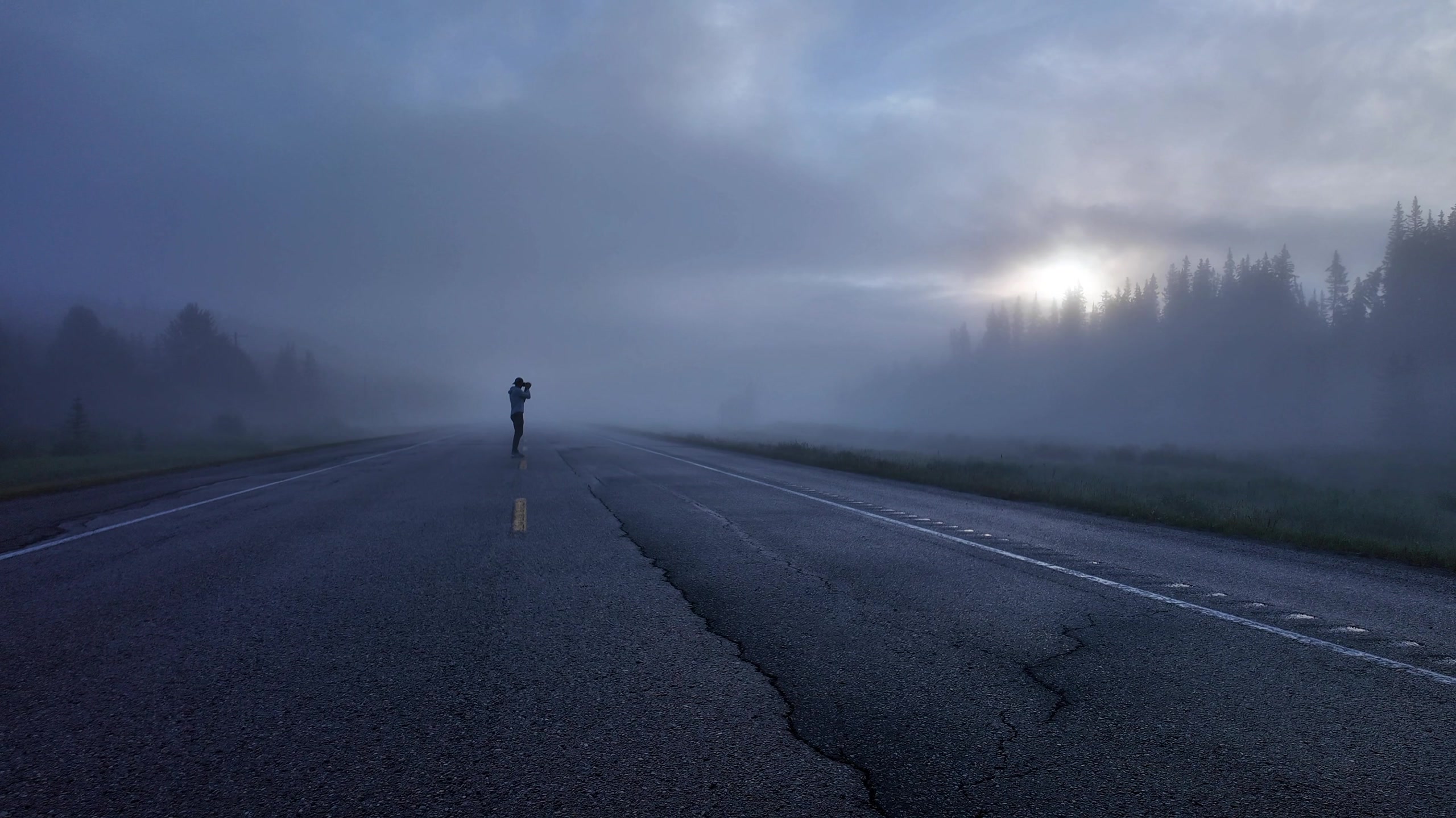 Bret at work in fog and low cloud — camera in hand, deep in the field.